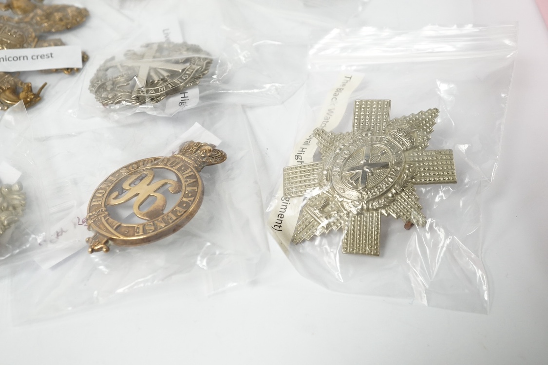 Eighteen Scottish and the Borders cap badges and Glengarry badges, including; Royal Scot Fusiliers, 96th Regiment of Foot, the Black Watch, Cameron Highlanders, Argyle and Sutherland Highlanders, Highland Light Infantry
